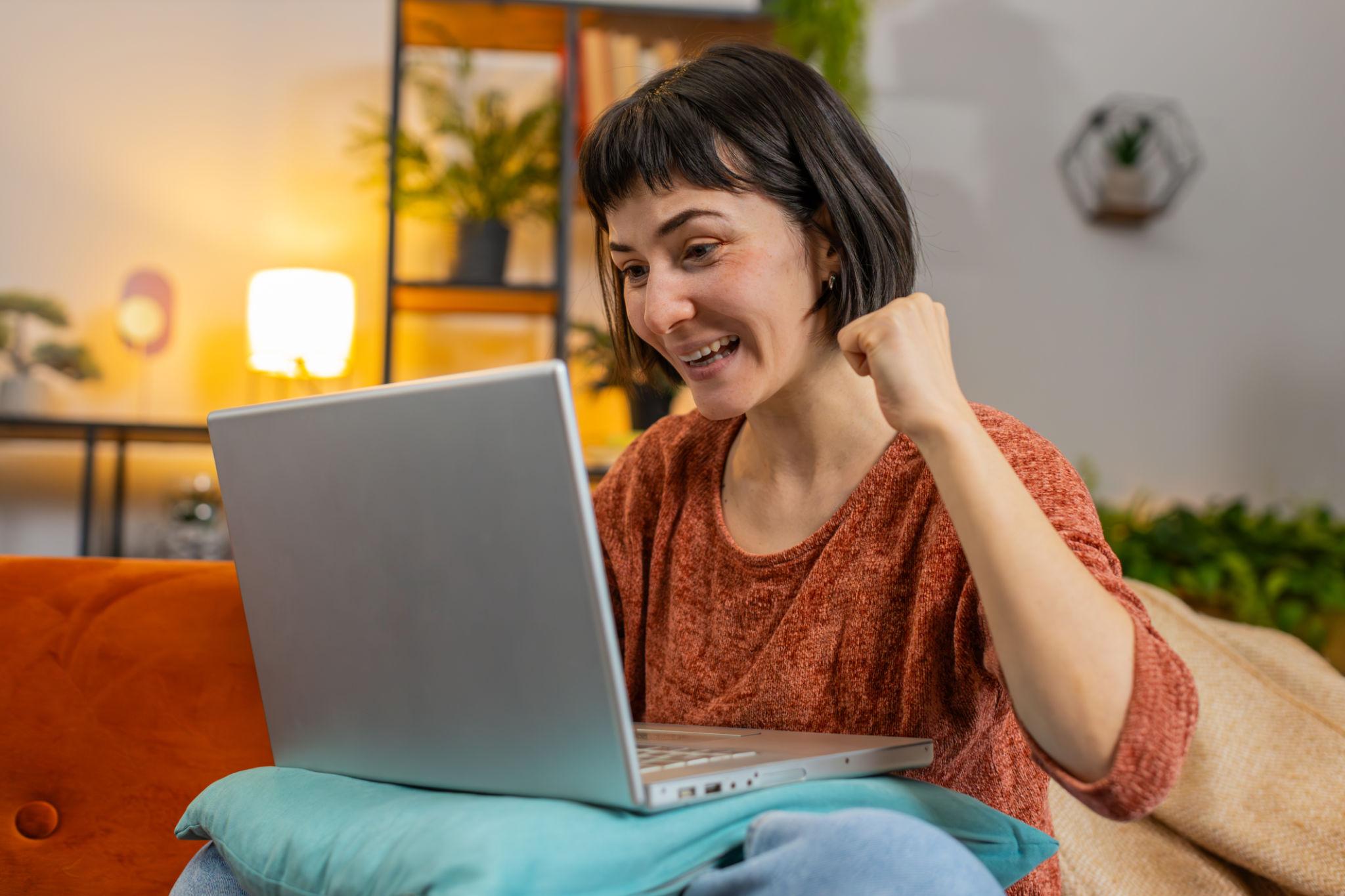 woman celebrating making money online.